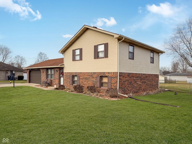 view of side of home featuring a garage and a lawn