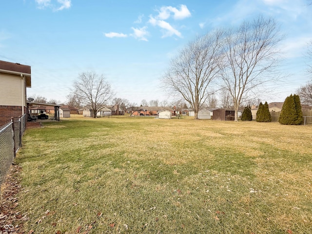 view of yard featuring a storage unit