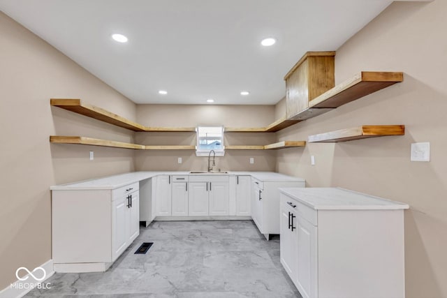 kitchen with sink and white cabinets