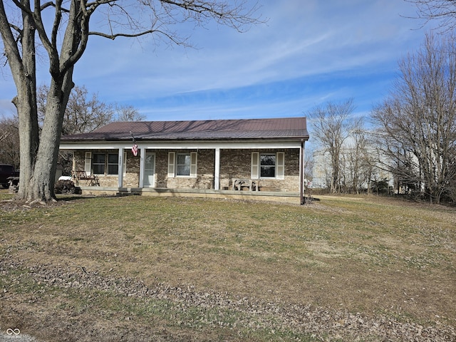 ranch-style home with a porch and a front yard