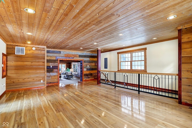 spare room with recessed lighting, wood finished floors, visible vents, wooden walls, and wood ceiling