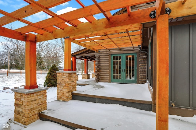 snow covered patio featuring fence, french doors, and a pergola