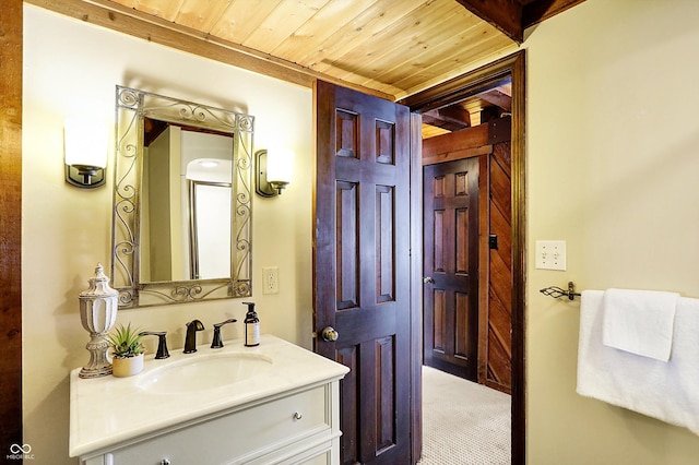 bathroom with vanity and wood ceiling