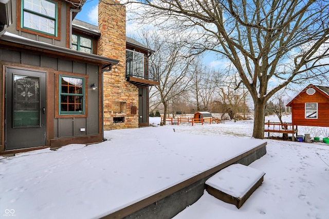 snowy yard with a fireplace