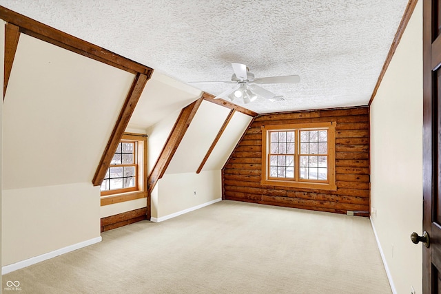 bonus room featuring baseboards, vaulted ceiling, log walls, light carpet, and a textured ceiling