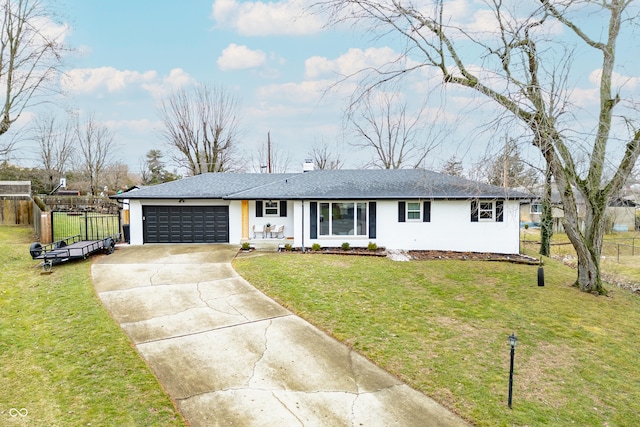 ranch-style home with a garage and a front yard