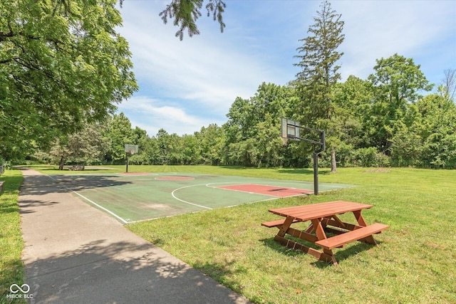 view of basketball court featuring a lawn