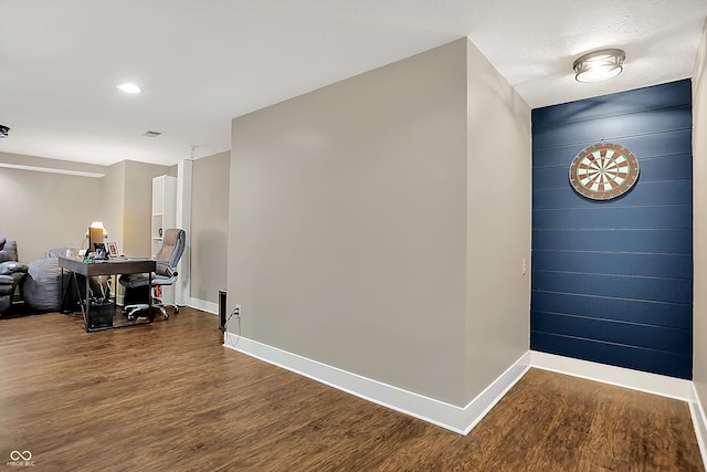 hallway with hardwood / wood-style flooring