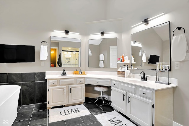 bathroom with vanity, plus walk in shower, and tile walls