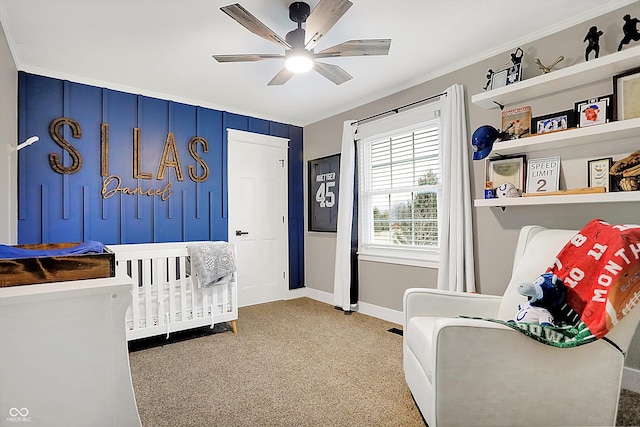 bedroom with ceiling fan, ornamental molding, and carpet