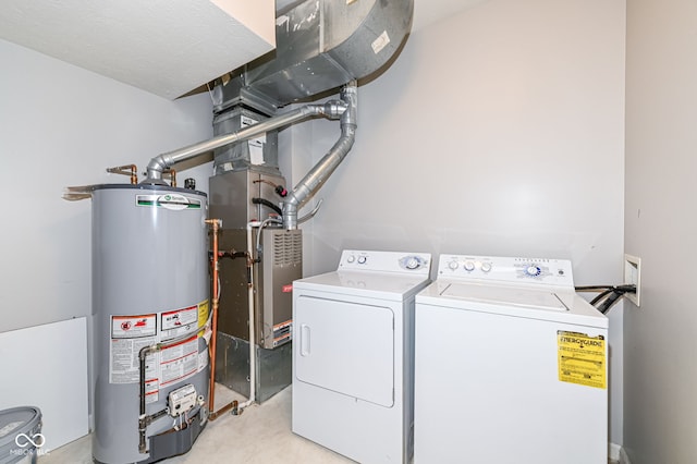 washroom featuring washer and clothes dryer and gas water heater