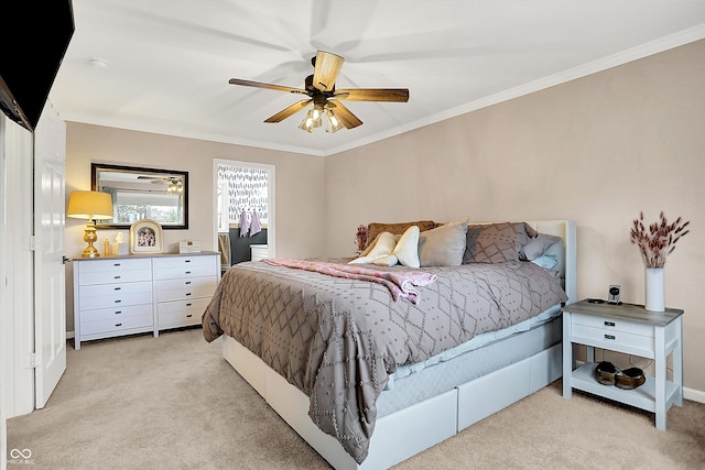 bedroom featuring ornamental molding, light carpet, and ceiling fan