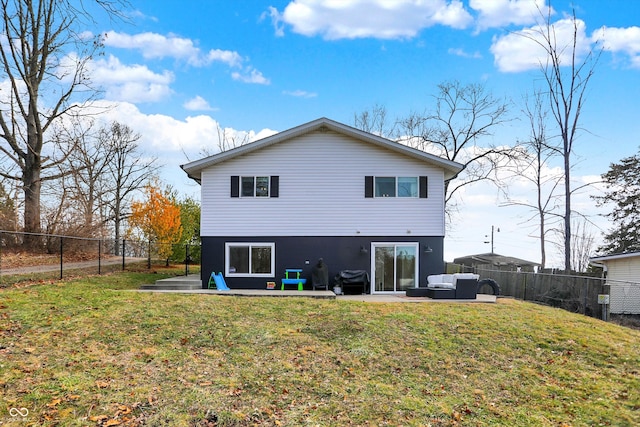 back of house with a lawn, outdoor lounge area, and a patio