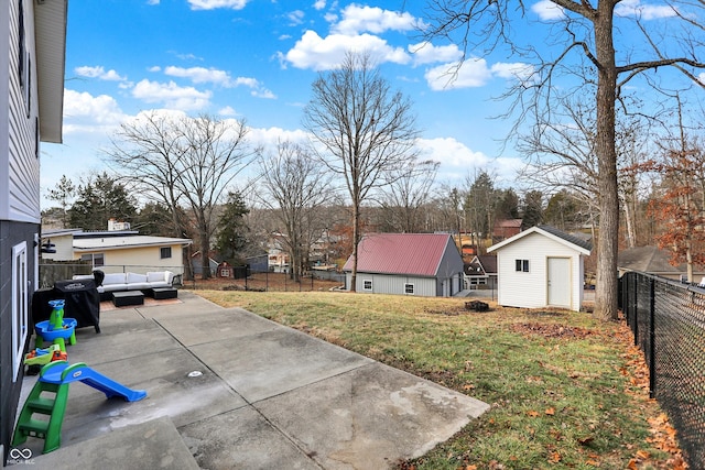 view of yard with an outdoor hangout area, a patio, and a storage unit