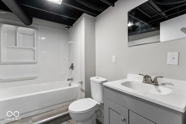 full bathroom with vanity, toilet,  shower combination, and hardwood / wood-style floors