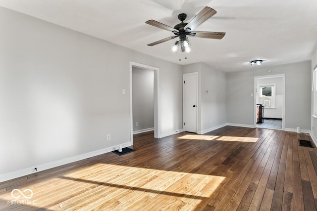 interior space featuring ceiling fan and dark hardwood / wood-style floors