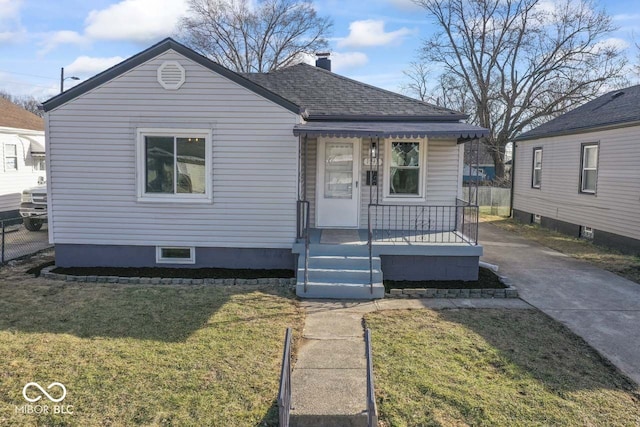 bungalow featuring a porch and a front lawn