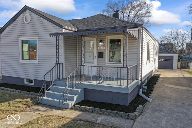 view of front of home featuring an outbuilding and a garage