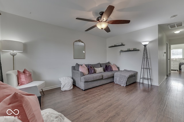 living room with wood-type flooring and ceiling fan