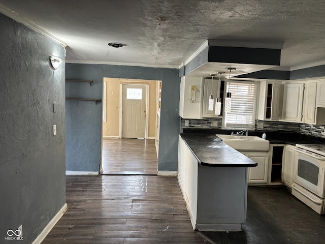 kitchen with dark wood-type flooring, sink, crown molding, white cabinetry, and white range with electric cooktop