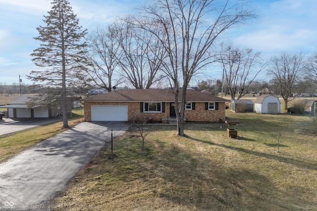 3052 S Fielding Rd, New Palestine, IN 46163 - ranch-style house with a garage, a front lawn, and a storage unit
