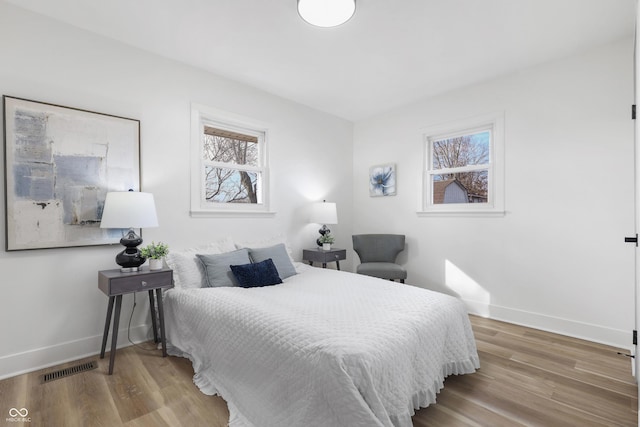 bedroom with wood-type flooring