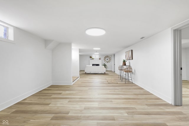 basement featuring light wood-type flooring