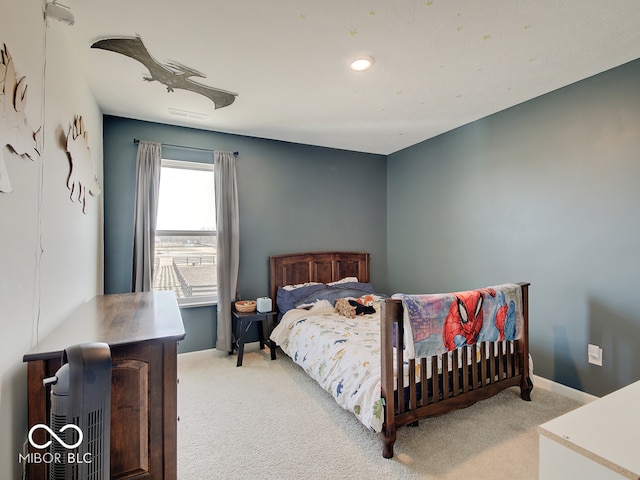 bedroom with light colored carpet