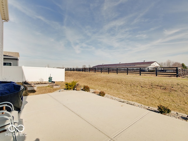 view of yard with a patio and a rural view