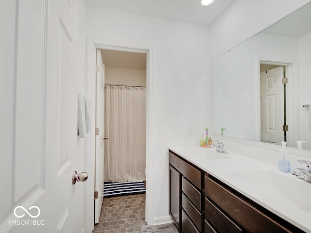 bathroom with a shower with curtain and vanity