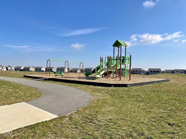 community play area featuring a lawn