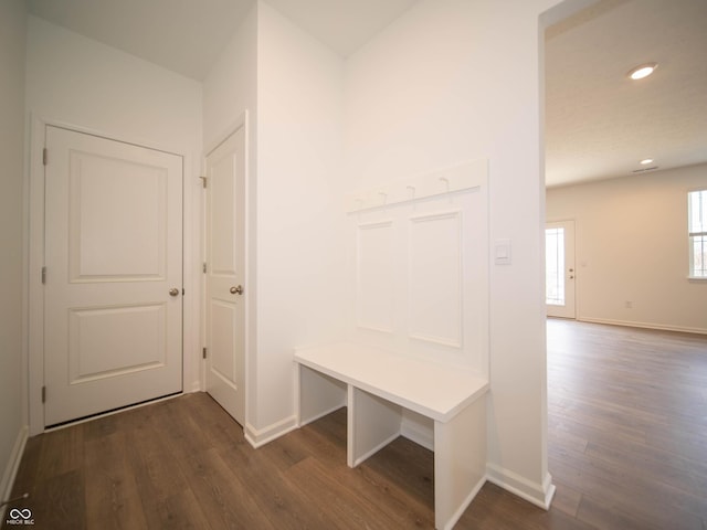 mudroom with dark wood-style floors, recessed lighting, and baseboards