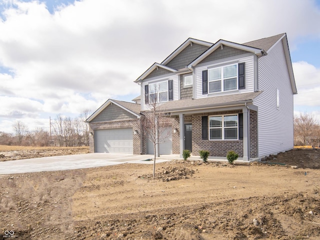 craftsman inspired home with driveway and brick siding