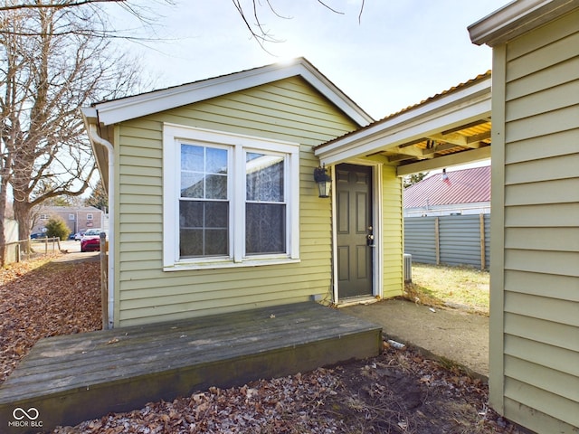 view of exterior entry featuring a deck