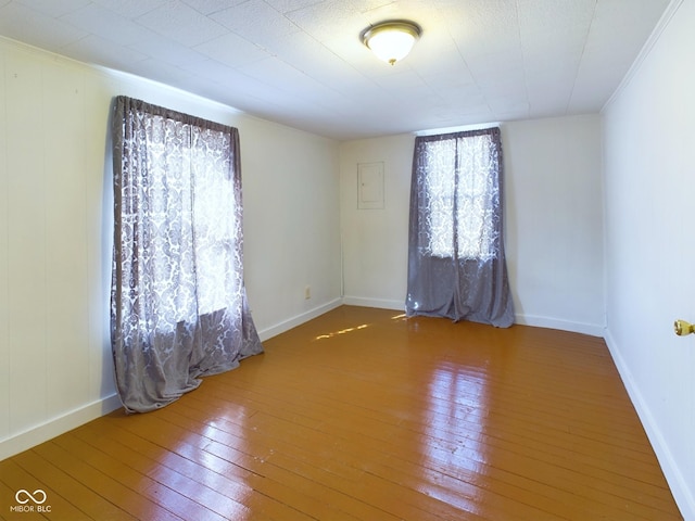 spare room with hardwood / wood-style floors