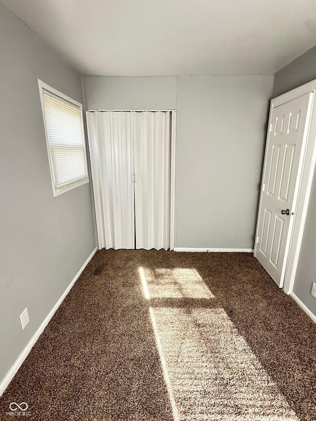 unfurnished bedroom with carpet floors