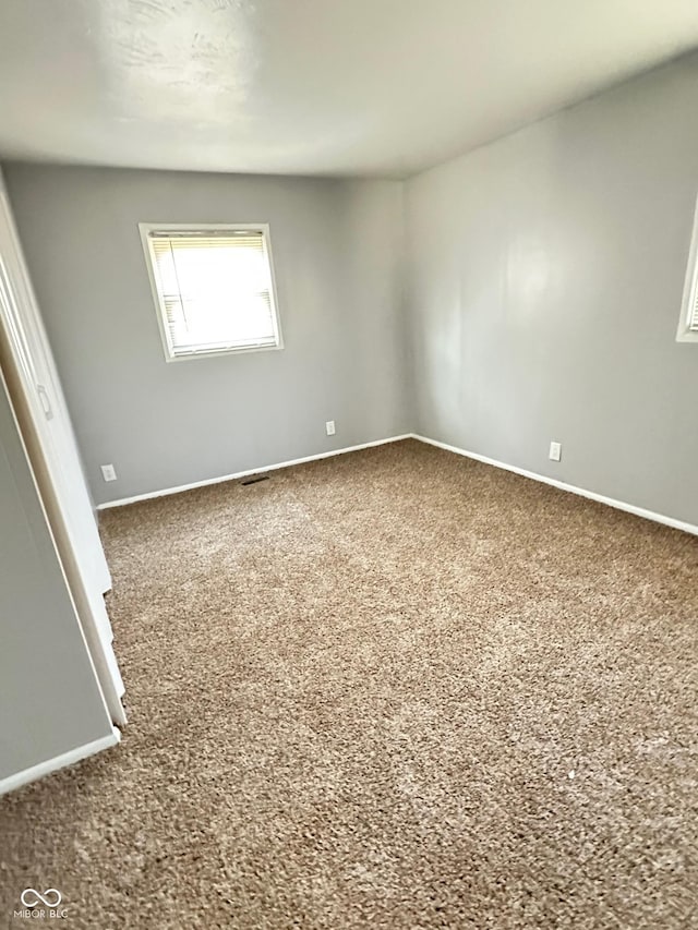 spare room featuring carpet flooring