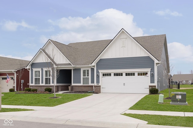 craftsman house with a garage and a front lawn