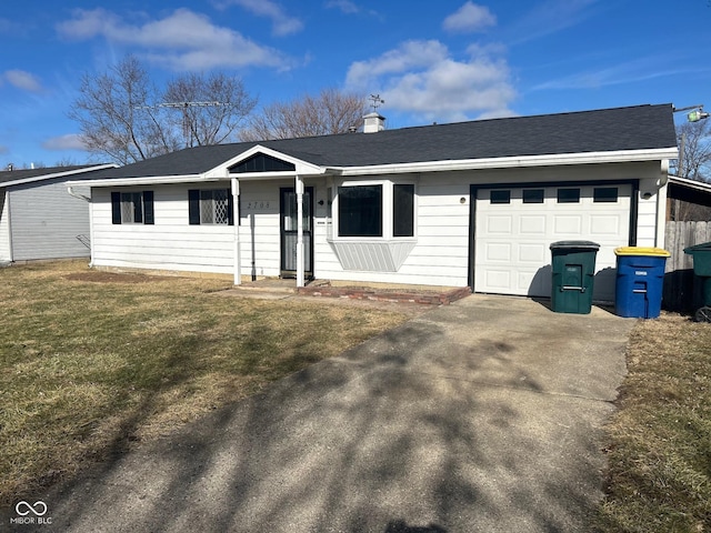 ranch-style house with a garage and a front yard