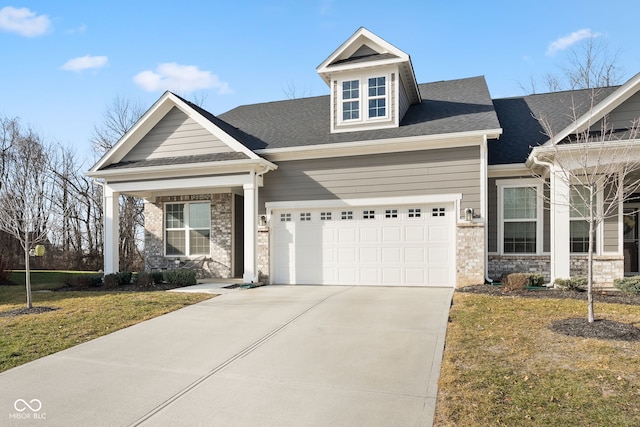 craftsman-style house with a garage and a front yard