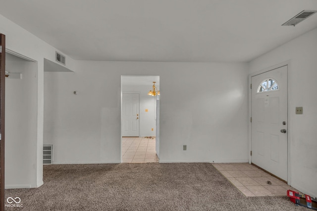 foyer with light carpet