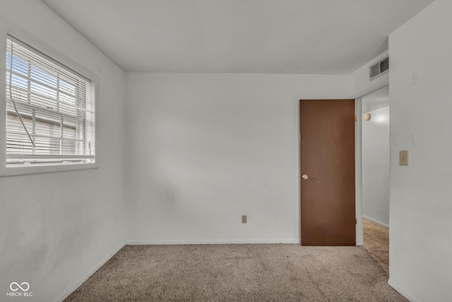 unfurnished room featuring carpet floors