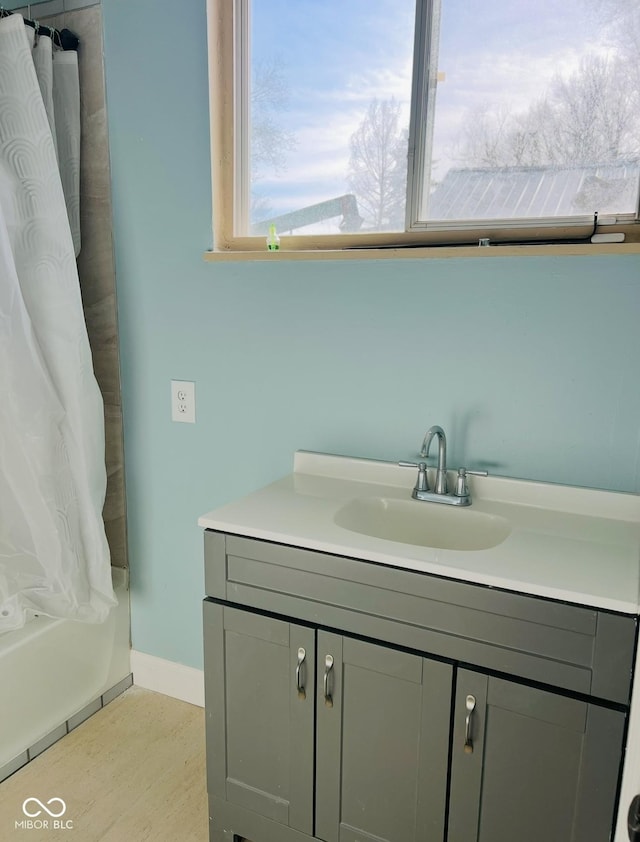 bathroom with vanity and a shower with shower curtain