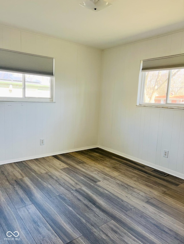 empty room featuring dark hardwood / wood-style floors