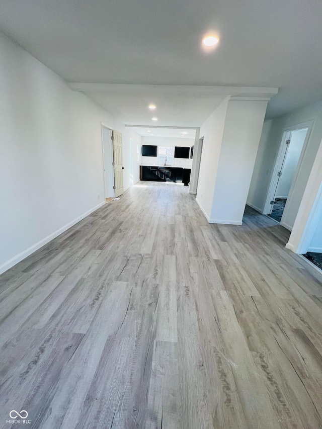 unfurnished living room featuring light hardwood / wood-style floors