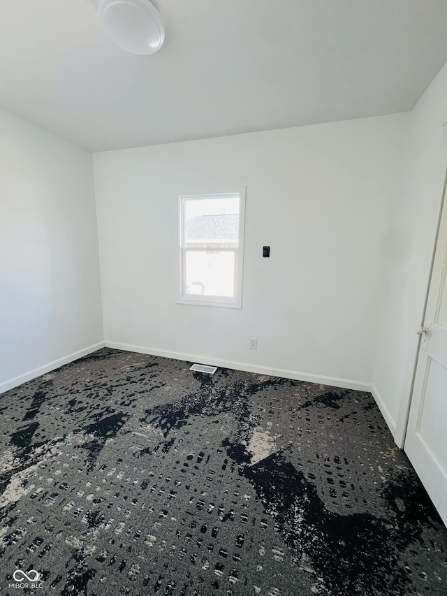 view of carpeted spare room