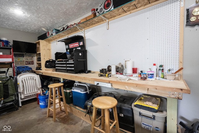 garage with a workshop area