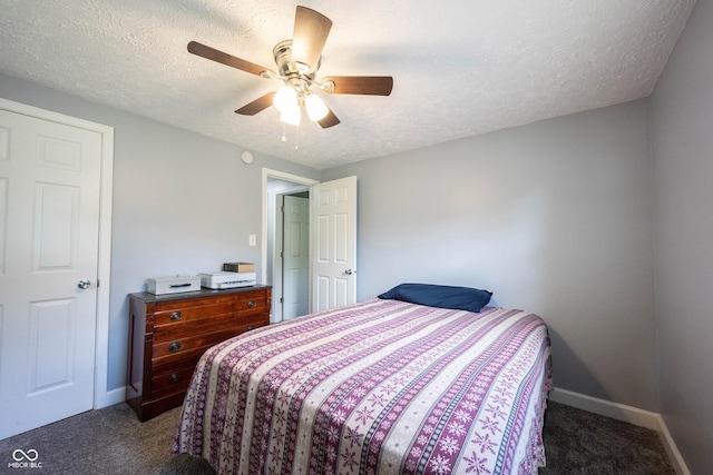 carpeted bedroom with ceiling fan and a textured ceiling