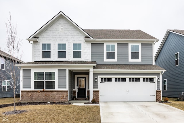 view of front facade featuring a garage and a front yard