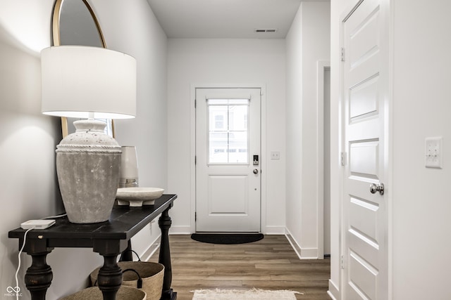 doorway to outside with hardwood / wood-style flooring